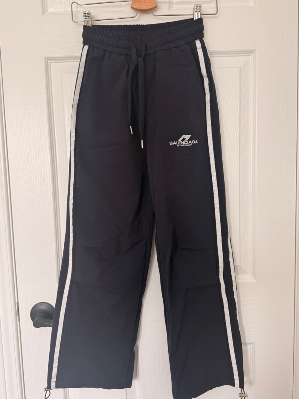 Balenciaga Dark Blue Track Pants with White Side Stripes and Logo